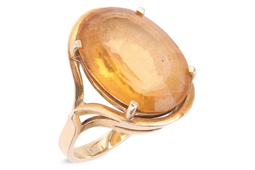 Lot 15 - A citrine dress ring, featuring a large oval...