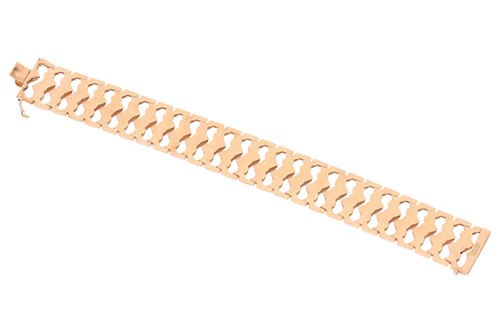 Lot An 18ct gold bracelet, consisting of wide...