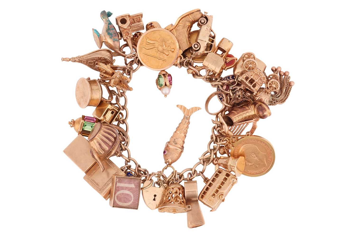 Lot A gold charm bracelet, including a 1911 half...