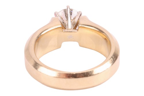 Lot A diamond solitaire ring, featuring a central...