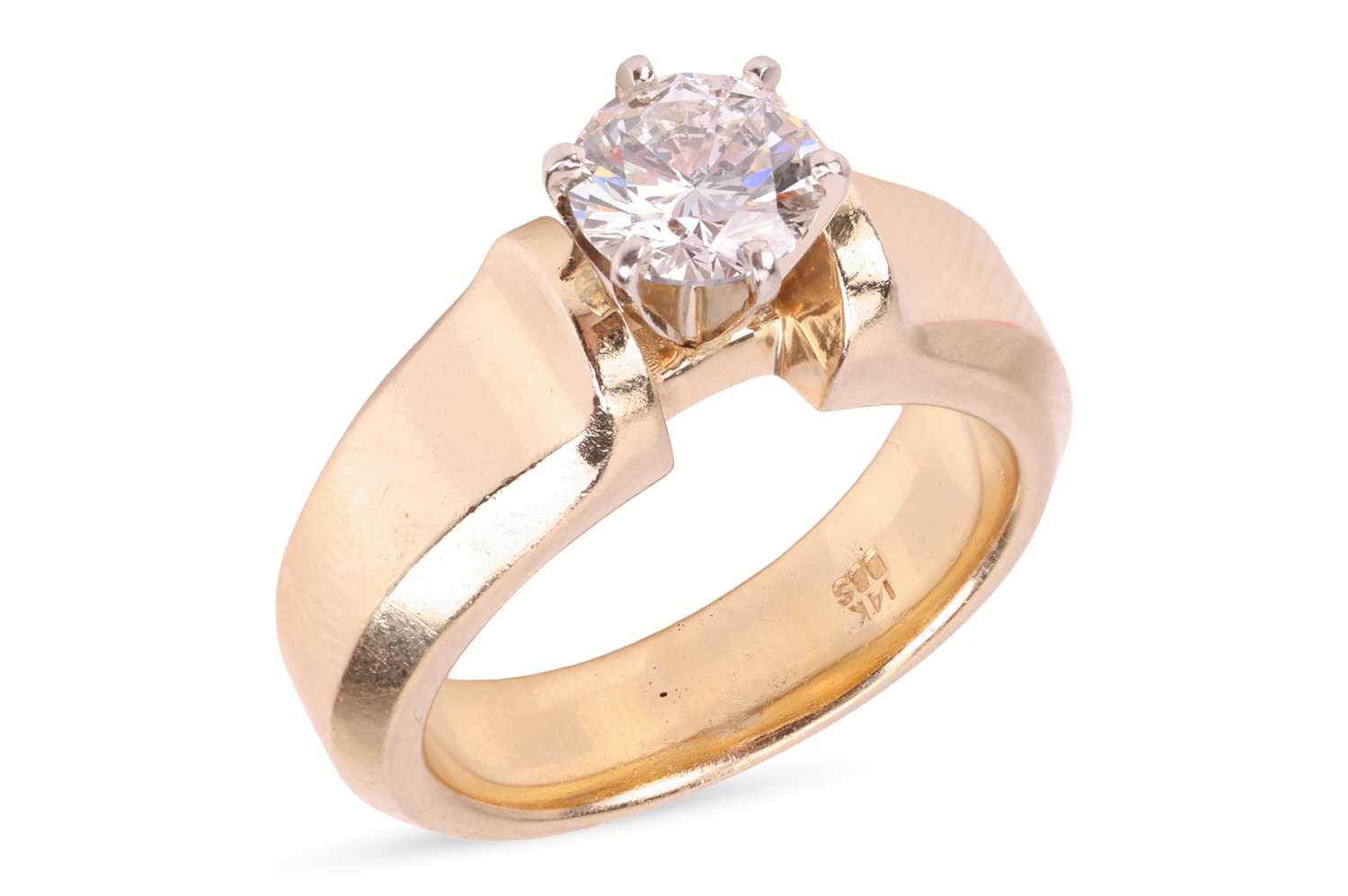 Lot A diamond solitaire ring, featuring a central...