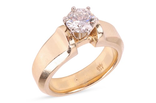 Lot 96 - A diamond solitaire ring, featuring a central...