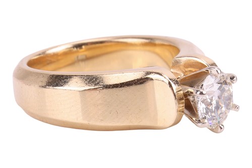 Lot A diamond solitaire ring, featuring a central...