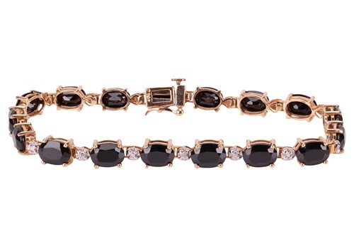 Lot 86 - A sapphire-set bracelet, composed of oval...