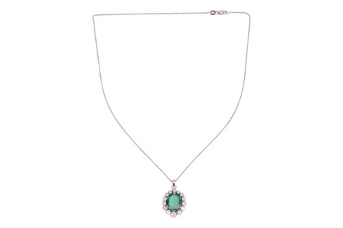 Lot An emerald and diamond pendant, in a cluster...
