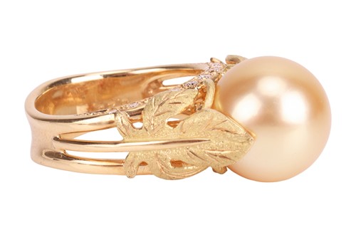 Lot 176 - A cultured pearl and diamond dress ring, the...