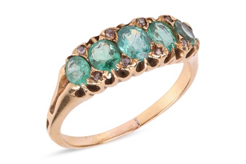 Lot 35 - An emerald and diamond ring, featuring five...