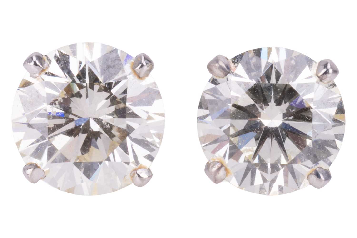 Lot 196 - A pair of diamond stud earrings, each...