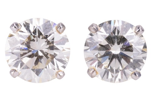 Lot 196 - A pair of diamond stud earrings, each...