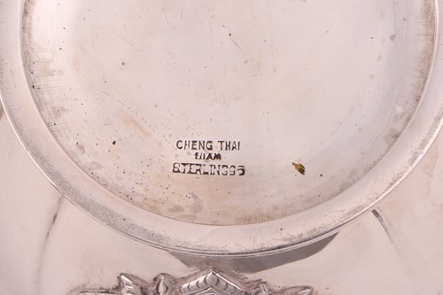 Lot 368 - A cased Thai ‘sterling silver’ four-piece tea...