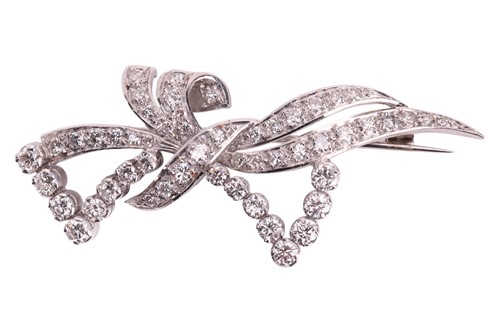 Lot 49 - A diamond-set bow brooch, of scrolling design,...