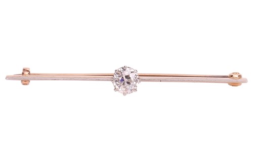 Lot 28 - A diamond bar brooch, featuring an old mine...