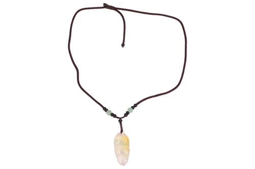Lot 36 - A carved hardstone necklace, possible jadiete...