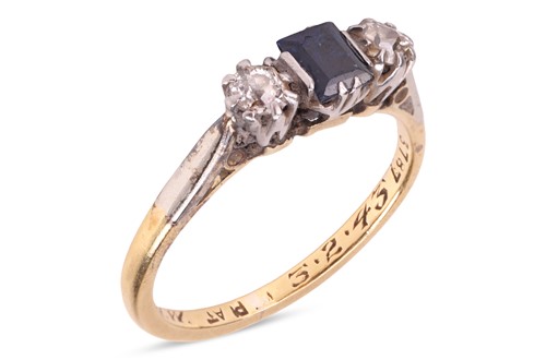 Lot 38 - A sapphire and diamond three-stone ring, the...