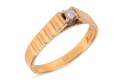 Lot 127 - A diamond single-stone ring, the four-claw set...