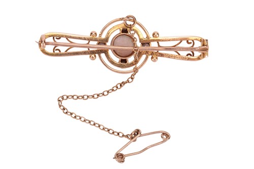 Lot An opal and diamond brooch, of openwork design,...
