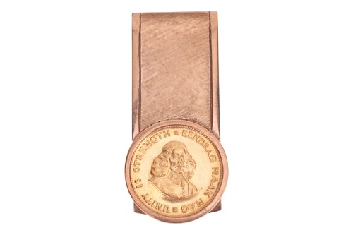 Lot 21 - A money clip with coin, the clip featuring a...