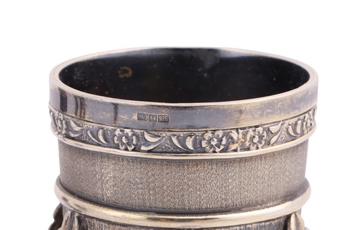 Lot 244 - A set of six silver-gilt kiddish cups, the...