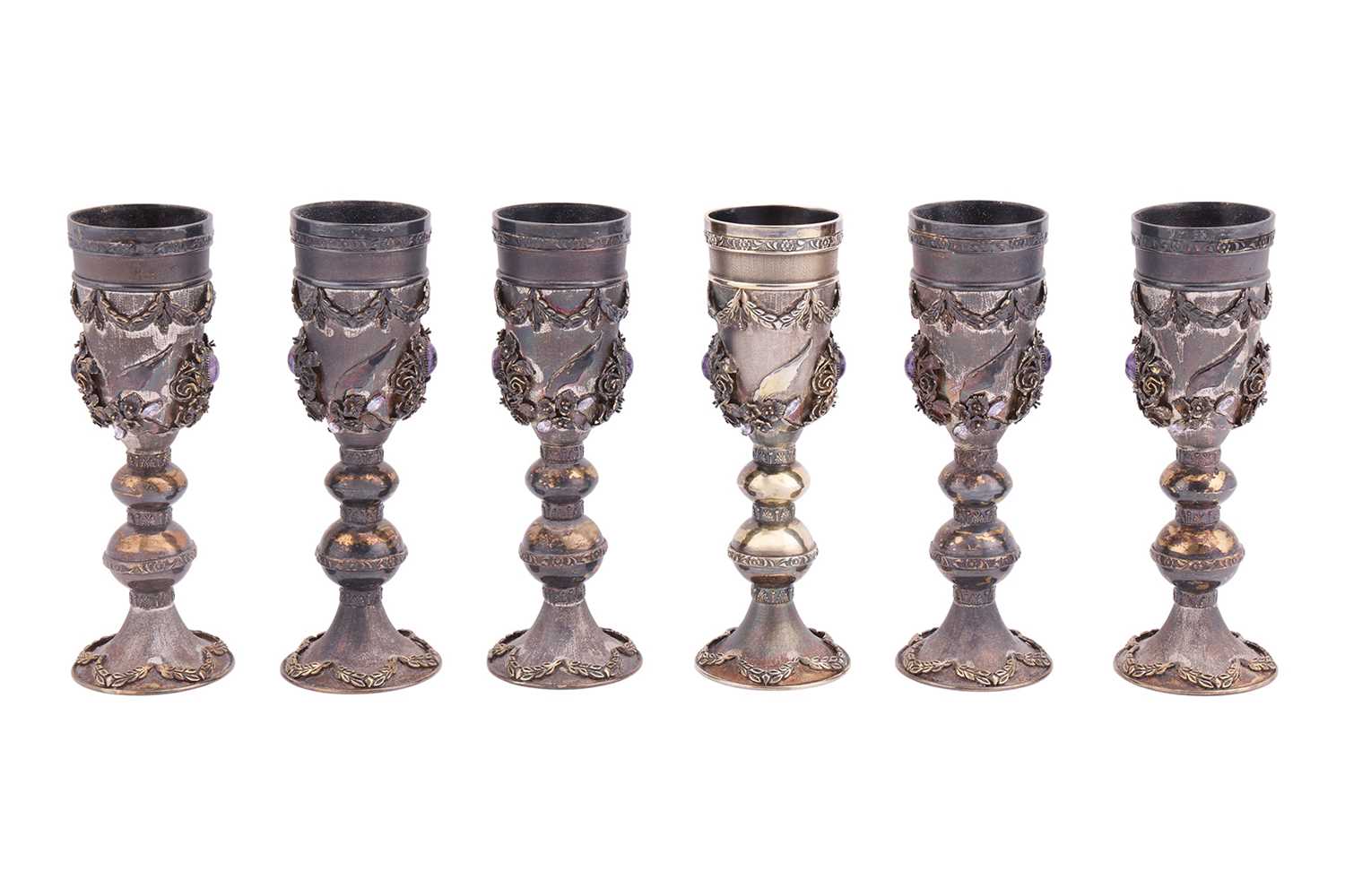 Lot 244 - A set of six silver-gilt kiddish cups, the...