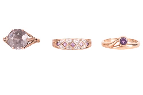 Lot 79 - Three gem-set rings; The first claw-set with a...