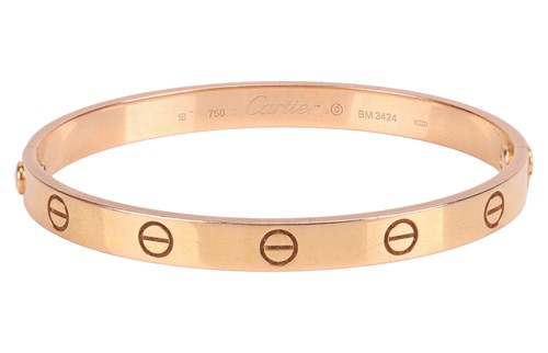 Lot 194 - Cartier - A 'LOVE' bangle in 18ct yellow gold,...