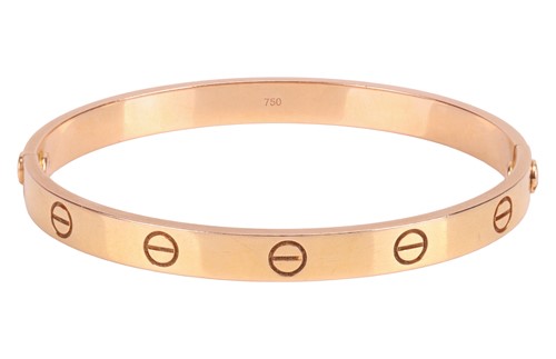 Lot 194 - Cartier - A 'LOVE' bangle in 18ct yellow gold,...