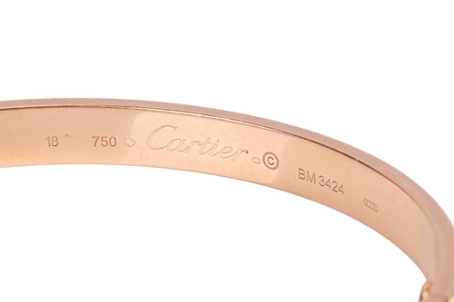 Lot 194 - Cartier - A 'LOVE' bangle in 18ct yellow gold,...