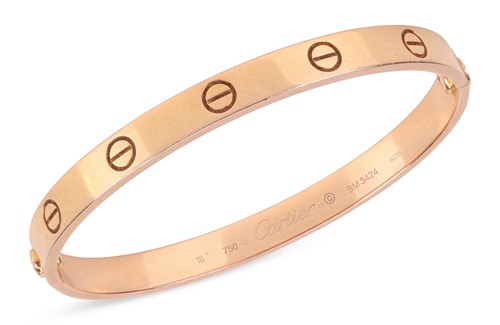 Lot 194 - Cartier - A 'LOVE' bangle in 18ct yellow gold,...
