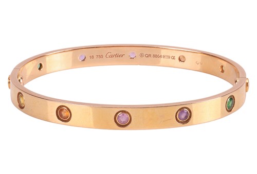 Lot 196 - Cartier - A rainbow 'LOVE' bangle, featuring...