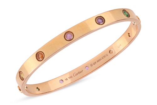 Lot 196 - Cartier - A rainbow 'LOVE' bangle, featuring...