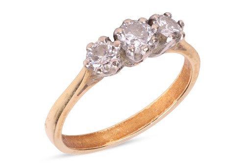 Lot 11 - A diamond-set three-stone ring, claw-set with...