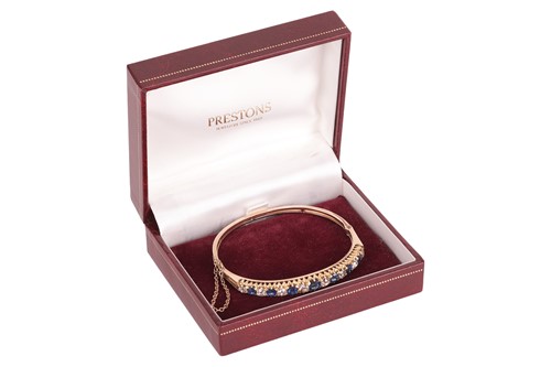Lot 43 - An old-cut diamond and sapphire hinged bangle,...