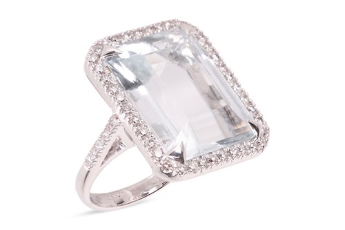 Lot 183 - An aquamarine and diamond cocktail ring,...