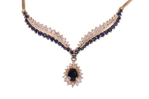 Lot 92 - A diamond and sapphire-set necklace, featuring...