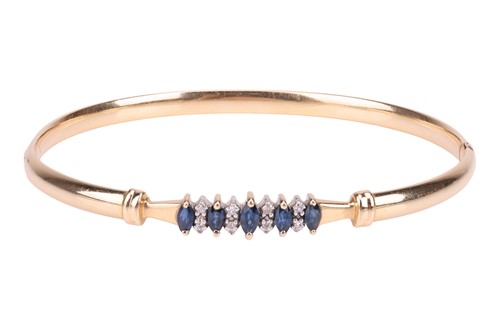 Lot 83 - A sapphire and diamond hinged bangle,...