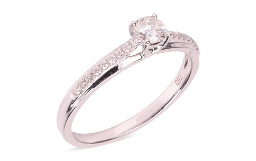 Lot 41 - A diamond solitaire ring, featuring a central...