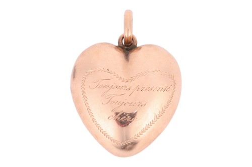 Lot 31 - A puffy hollow heart locket pendant, with...