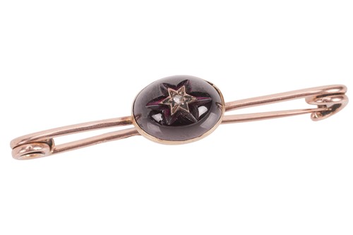 Lot An amethyst and diamond bar brooch, the...