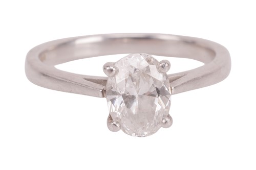 Lot 184 - A diamond solitaire ring, featuring a central...