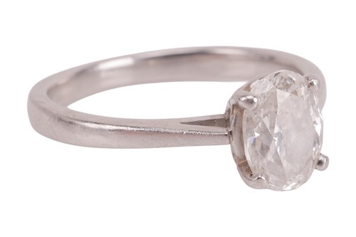 Lot 184 - A diamond solitaire ring, featuring a central...