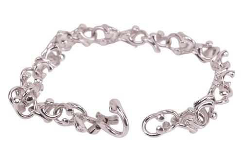 Lot 169 - Georg Jensen - A diamond-set ‘Magic’ link...