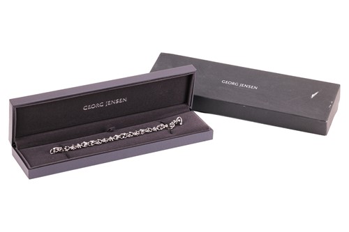 Lot 169 - Georg Jensen - A diamond-set ‘Magic’ link...