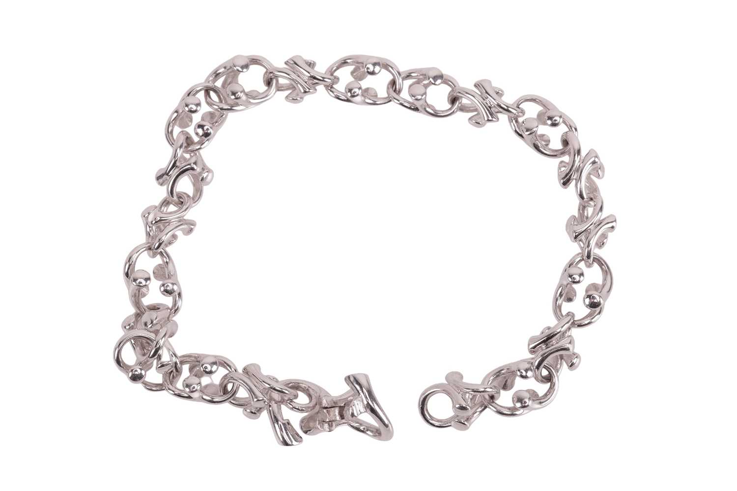 Lot 169 - Georg Jensen - A diamond-set ‘Magic’ link...