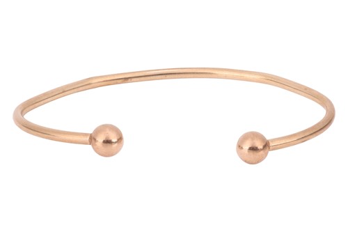 Lot 64 - A 9ct gold torque bangle, formed of hollow...