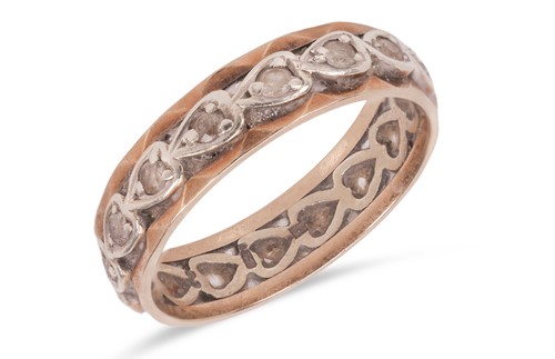 Lot 66 - A paste eternity ring, the metal with faceted...