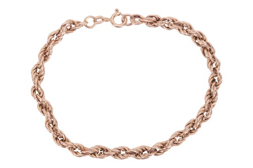 Lot 18 - A twisted rope link bracelet in 9ct yellow...