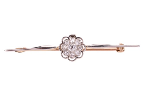Lot 13 - A diamond-set bar brooch, featuring a central...