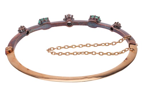 Lot 9 - An Early Victorian emerald and diamond bangle,...