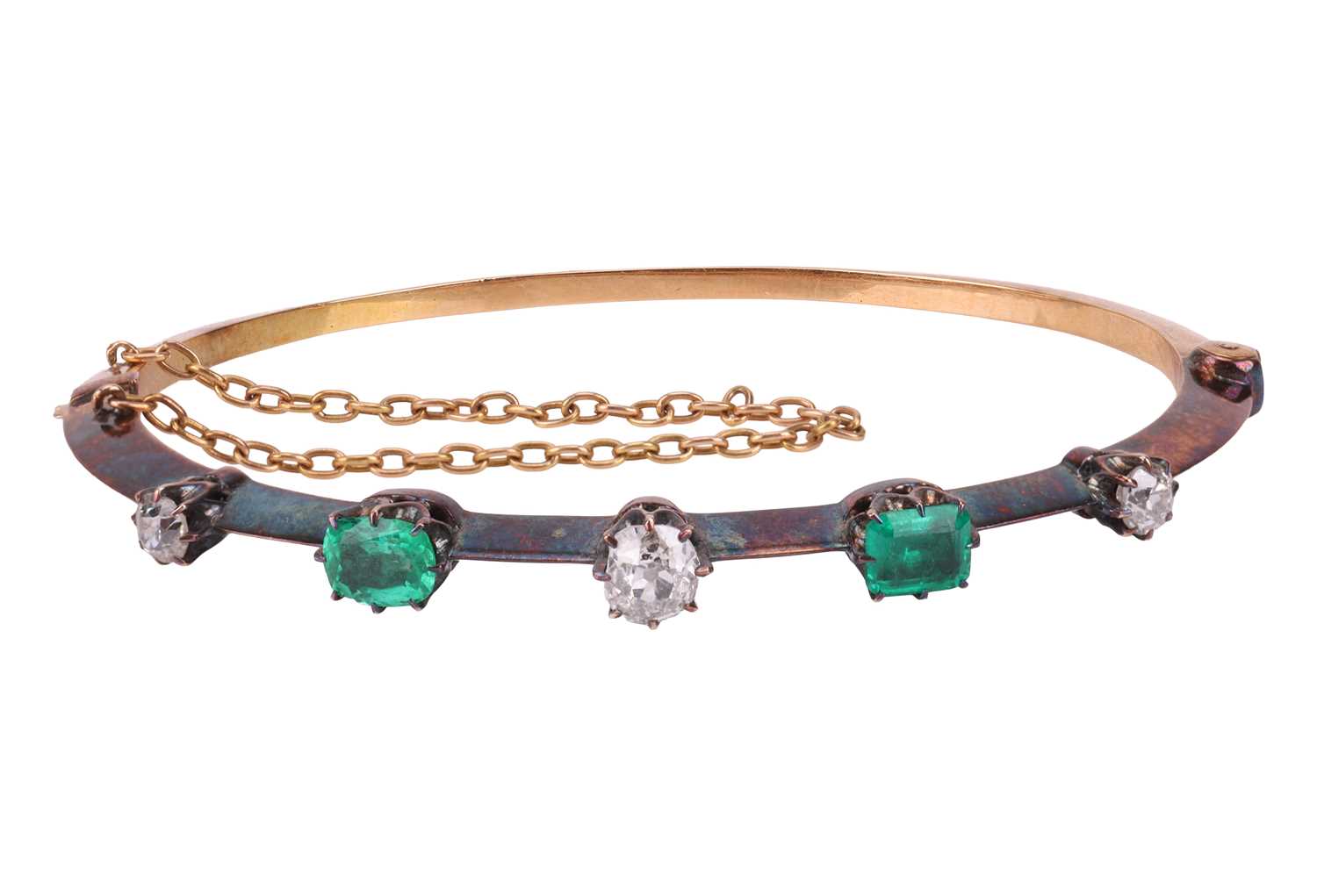 Lot 9 - An Early Victorian emerald and diamond bangle,...