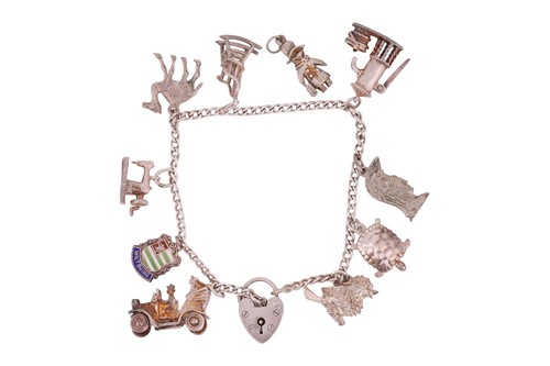 Lot 60 - A charm bracelet, comprising ten charms (one...